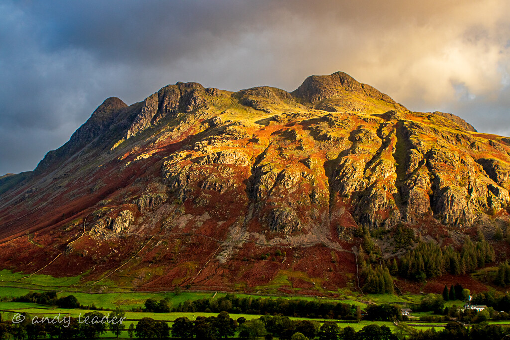 Dawn light on the langdale pikes in cumbria.
