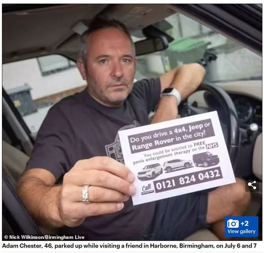 An unhappy man holding a leaflet posted on his car which says, "Do you own a 4x4, jeep or range rover in the city?
You could be entitled to penis enlargement therapy on the NHS.